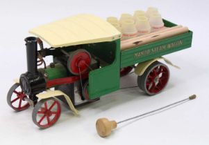 A Mamod SW1 steam wagon of usual specification, comprising green and red body with red spoked