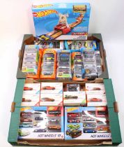 Two trays containing a quantity of modern release Hot Wheels gift sets, Hot Wheels ID, and action