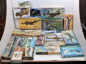 Two boxes containing 20 mixed scale mainly military plastic kits to include Airfix, Frog,