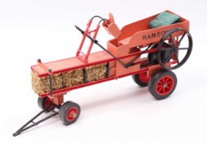 A scratch built Ransomes vintage baler, handpainted in two-tone red with working Lego Technic