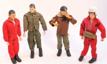 A collection of 4 vintage Palitoy Action Man Dolls, with flock hair and painted heads, dressed in