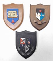 Terry Pratchett Discworld Collectors Shield Group, 3 examples, to include Unseen University Coat