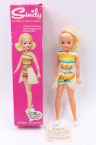 A Pedigree No. S676 Sindy Doll dressed in beach outfit, with white skirt & shoes, and red