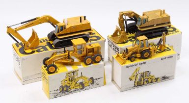 One box containing four boxed Caterpillar related earth moving diecast vehicles including an NZG