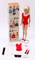 An original Barbie Doll, number 850 comprising figure in red swimming costume with black shoes and a