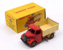 Dinky Toys No. 410 Bedford End Tipper, comprising of a red cab and chassis with cream back and red