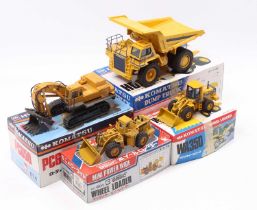 A collection of Japanese Shinsei, Komatsu-related diecast vehicles including a hydraulic excavator