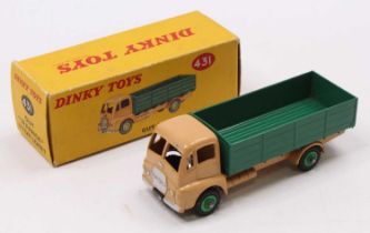 Dinky Toys No. 431 Guy Warrior 4-ton lorry comprising a tan cab, dark green back, and mid-green