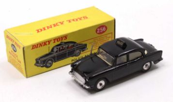 Dinky Toys No. 256 Police Patrol Car, black body, with a cream interior, 2 figures, and spun hubs,