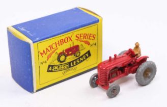 Matchbox Lesney No. 4a Massey Harris Tractor in red with mudguards, gold trim and driver figure,