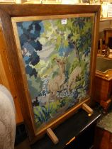 A mid-20th century oak and tapestry inset fire screen, w.55cm