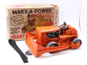 A Marx Toys battery operated Giant Bulldozer, orange plastic body & blade, with rubber tracks (one