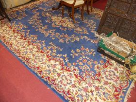 A Persian woollen blue ground Tabriz rug, with all-over floral stylised decoration, 360 x 261cm