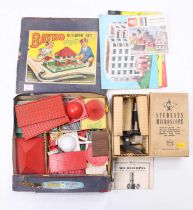 A boxed Bayko building set with contents together with a J & L Randall Students Microscope