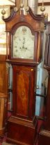 A George III mahogany and satinwood inlaid longcase clock, having an arched painted dial signed