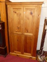 A modern pine double door wardrobe, w.109cm