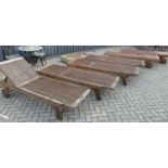 A set of six contemporary stained and slatted teak sun loungers, having adjustable ratchet