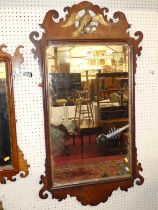 A 19th century Chippendale style mahogany fret cut rectangular wall mirror, with gilt eagle surmount