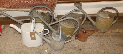 Six various galvanised metal watering cans; together with an enamel example (7)