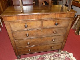 A circa 1830s mahogany squarefront chest of two short over three long graduated drawers, to turned