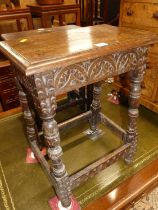 A joined oak and chip carved joint stool, raised on turned and square cut supports, length 43.5cm