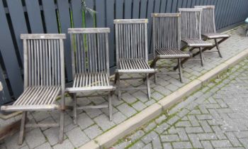 A set of six contemporary slatted teak folding garden patio chairs, each w.44.5cm