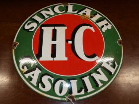 An enamel on metal circular convex advertising sign for Sinclair Gasoline, dia.30cm