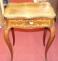 A circa 1900 French rosewood and floral satinwood inlaid hinge topped dressing table, having a