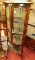 An Edwardian mahogany and chequer strung bowfront double door glazed corner display cabinet, h.152cm