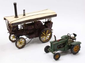 A modern issue tinplate model of a Fowler Showmans Traction Engine together with that of a John