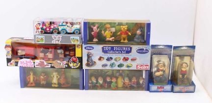 A collection of Disney collectibles including a set of Bullyland Germany Snow White and the Seven