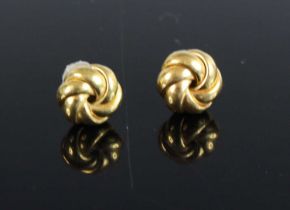 A pair of modern 18ct gold 'ball of wool' ear studs, 1.8g, dia.9mm; together with a pair of larger