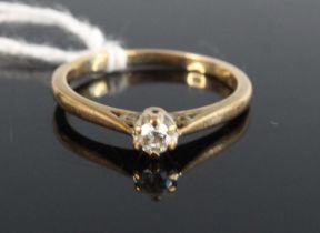 A 9ct gold diamond solitaire ring, the claw set round cut having stated weight as 0.15ct, 2.2g, size