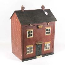 A early 20th century dolls house, in the form of a two-storey town house, having a faux slate roof