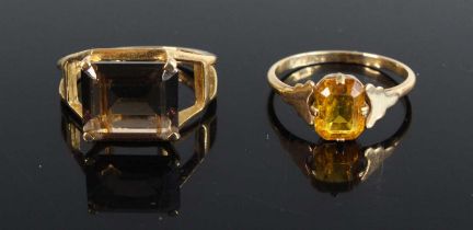 A 9ct gold citrine set dress, size N, together with a modern 9ct gold smoky quartz set dress ring,