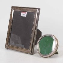A sterling silver clad easel photograph frame, of rectangular form, 21 x 16cm; together with a