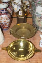 A brass offerings bowl, having twin handles and spot-hammered finish, w.35cm; together with