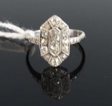 An Art Deco platinum and diamond tablet ring, the setting measuring approx 15.5 x 9mm and set with