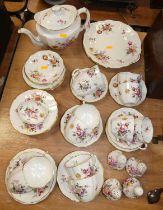 A Crown Derby 12-place setting tea service in the Derby Posies pattern, having printed mark verso;