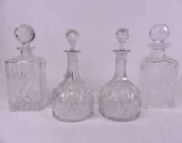 A pair of cut glass decanters and stoppers of mallet shape, height 23cm, together with two others of