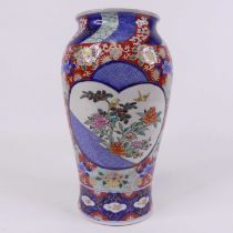 A Japanese Imari pattern vase of inverse baluster form, enamel decorated with birds and flowers,