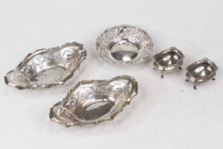 A pair of Edwardian silver bonbon dishes, of pierced oval form; together with another Edwardian