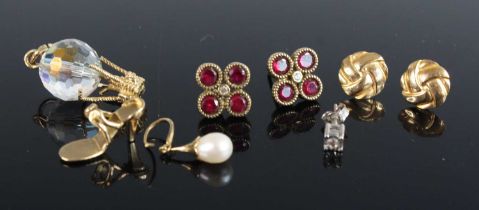 A white metal diamond set single ear stud; a pair of ruby and white sapphire set ear studs of square