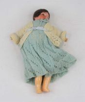 An early 20th century Armand Marseilles bisque headed doll having rolling glass eyes, showing four