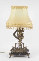 A late 19th century continental gilt metal table centrepiece, the single sconce supported by a