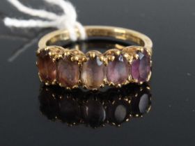 An Edwardian style 9ct gold and amethyst half hoop ring, 2.7g, size N