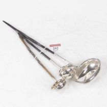 A George III silver toddy ladle, of oval form with beaded rim, inset with a George III shilling,