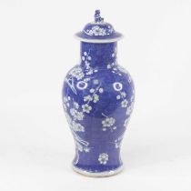 A Chinese export porcelain blue and white vase and cover, of baluster form, the domed cover with