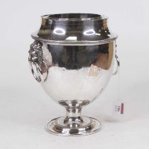 An early 20th century silver plated wine cooler of urn shape, with beaded rim, lion mask ring