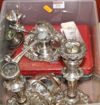 A box of miscellaneous metalware to include a pair of Old Sheffield plate table candlesticks,